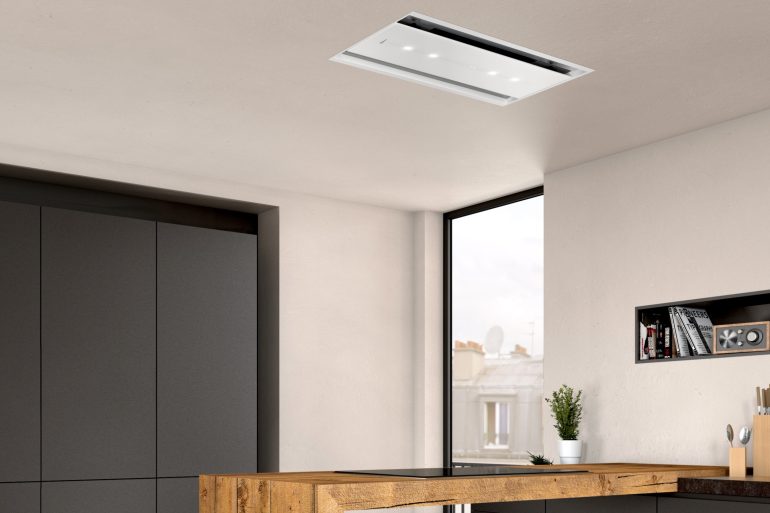 NEFF's 90cm ceiling cooker hood in white glass features Home Connect for remote operation via smartphone or tablet.